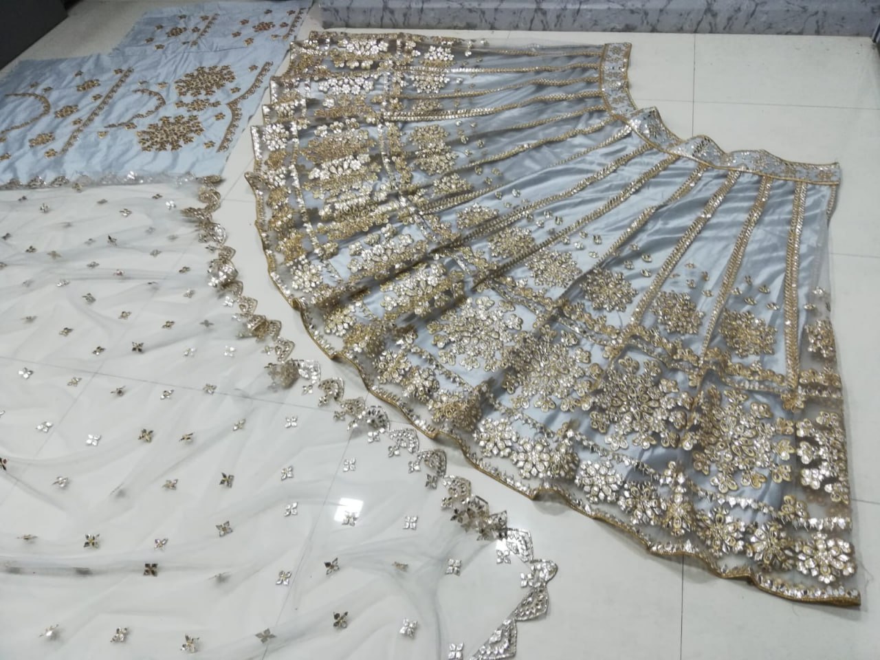 ELEGANT GRAY NET LEHENGA CHOLI SET WITH PAPER MIRROR EMBROIDERY WORK