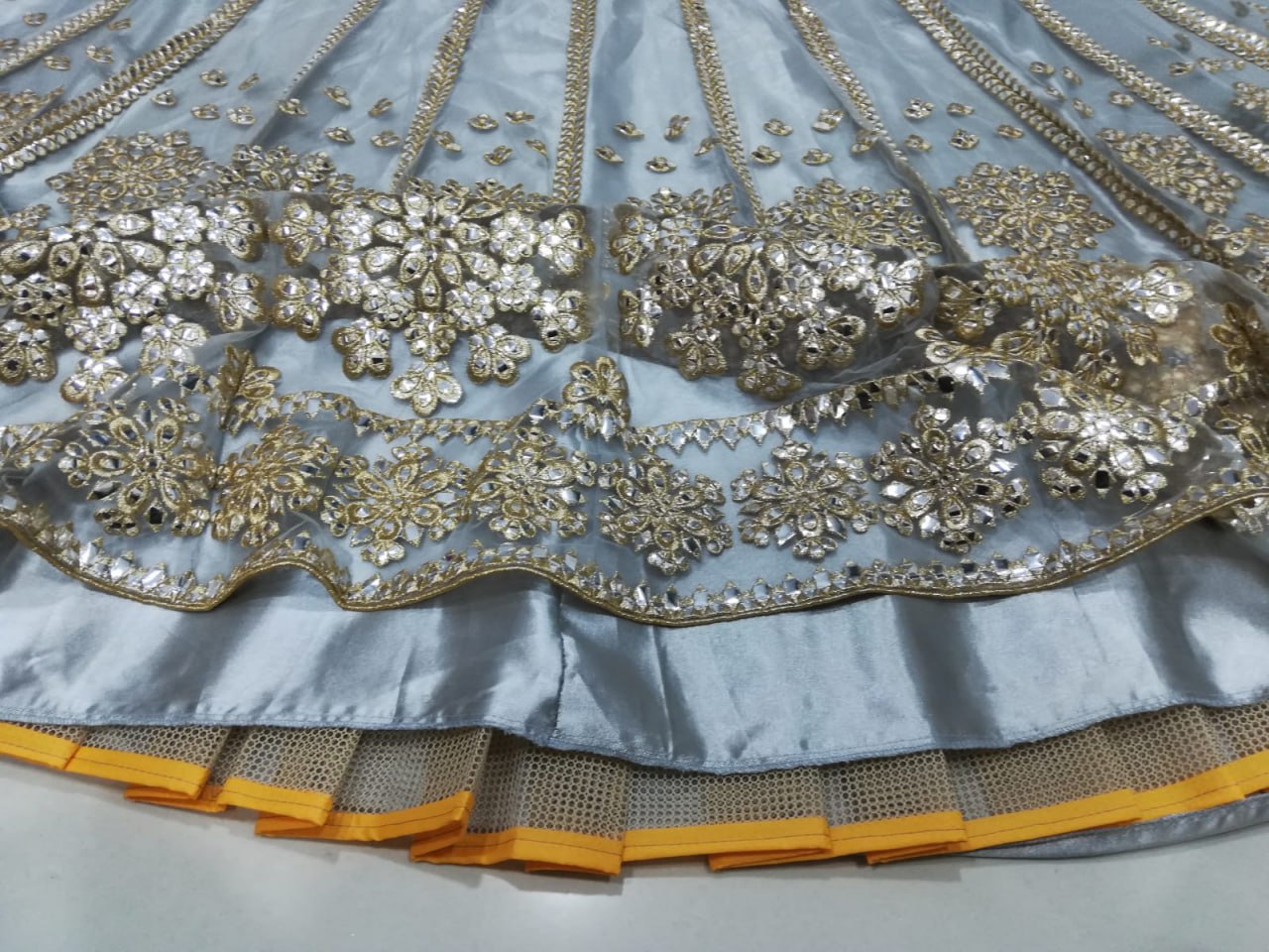 ELEGANT GRAY NET LEHENGA CHOLI SET WITH PAPER MIRROR EMBROIDERY WORK