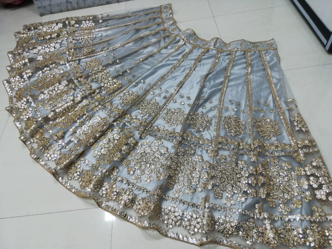 ELEGANT GRAY NET LEHENGA CHOLI SET WITH PAPER MIRROR EMBROIDERY WORK