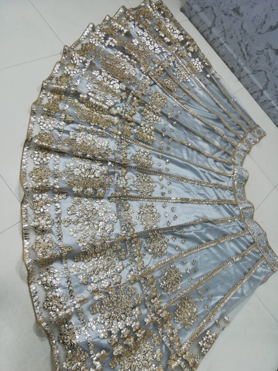 ELEGANT GRAY NET LEHENGA CHOLI SET WITH PAPER MIRROR EMBROIDERY WORK