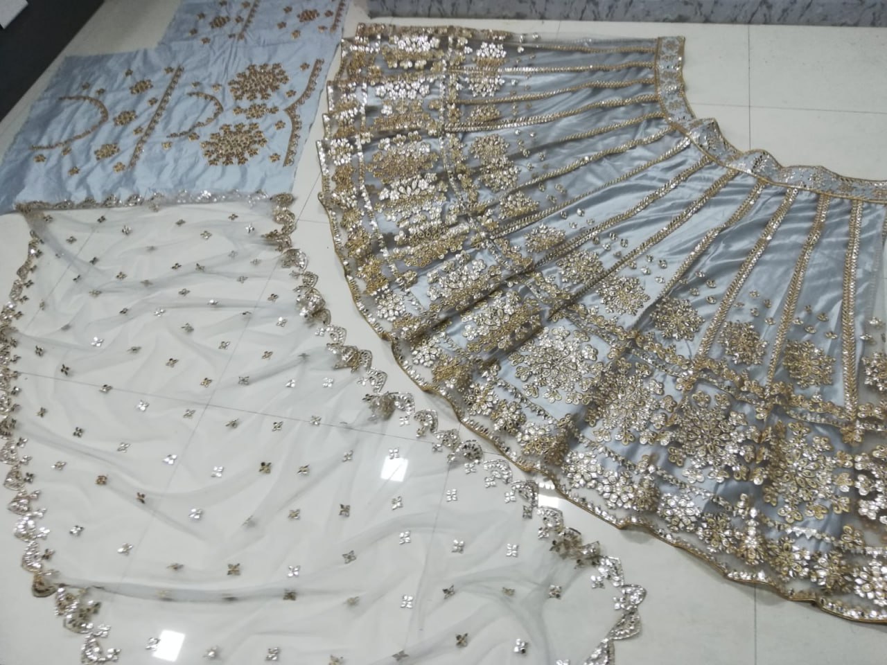 ELEGANT GRAY NET LEHENGA CHOLI SET WITH PAPER MIRROR EMBROIDERY WORK