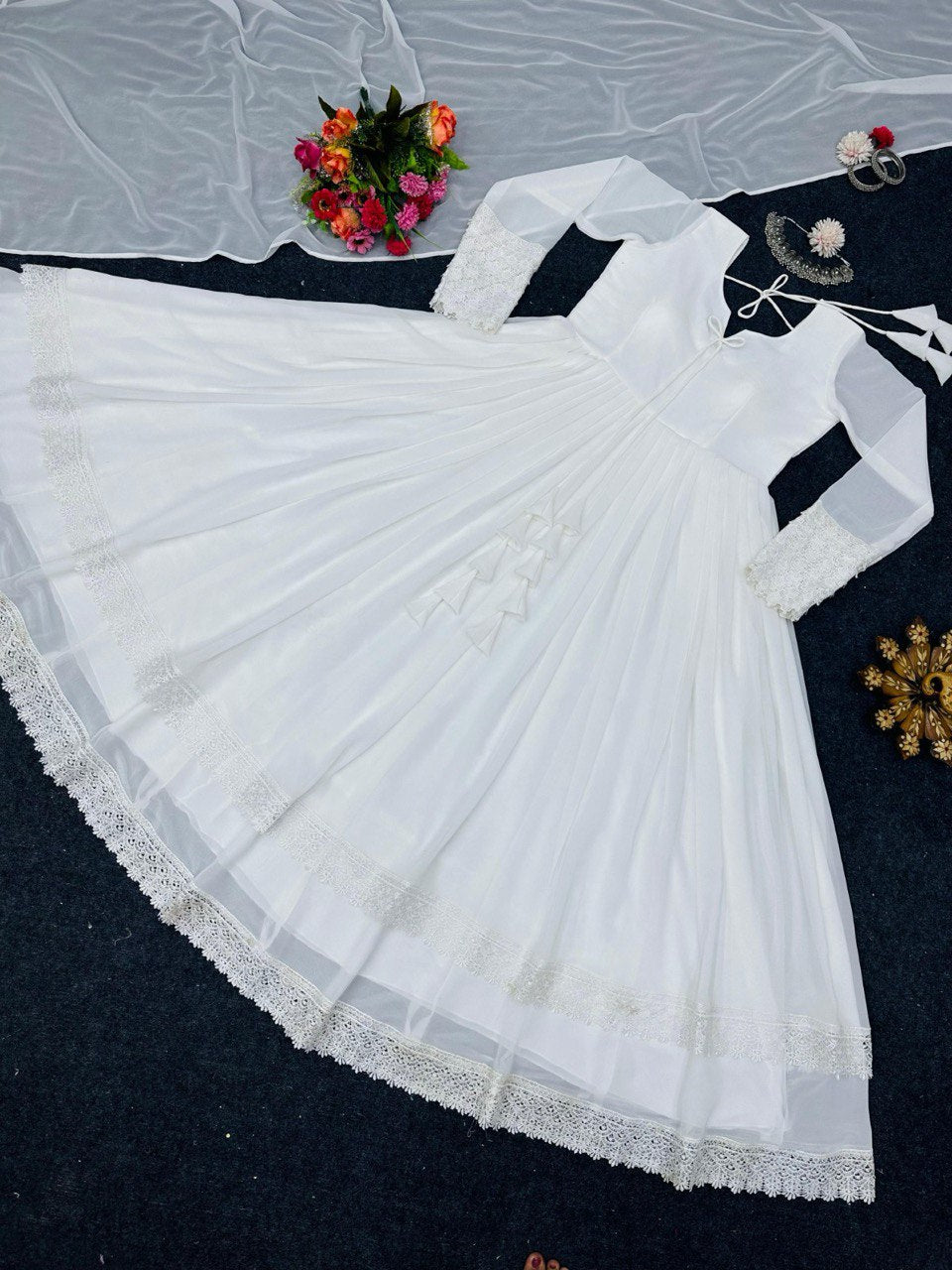 ELEGANT DESIGNER GOWN IN FAUX GEORGETTE WITH LACE WORK & TASSELS – A PERFECT BLEND OF GRACE & STYLE
