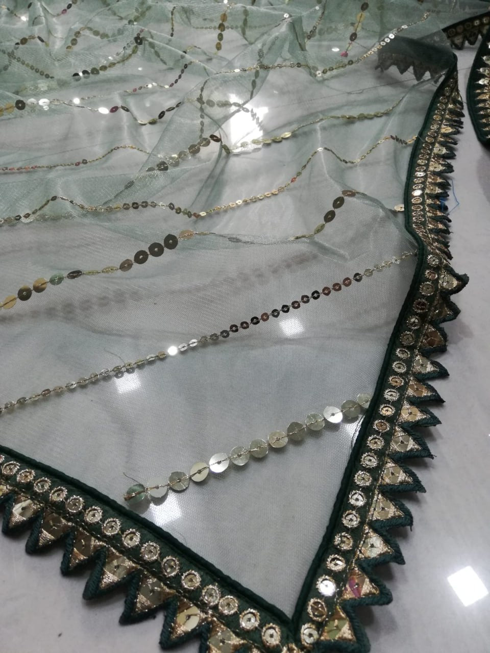 BOTTLE GREEN FAUX GEORGETTE DESIGNER LEHENGA SET WITH MULTI-SIZE SEQUINS & JARI EMBROIDERY