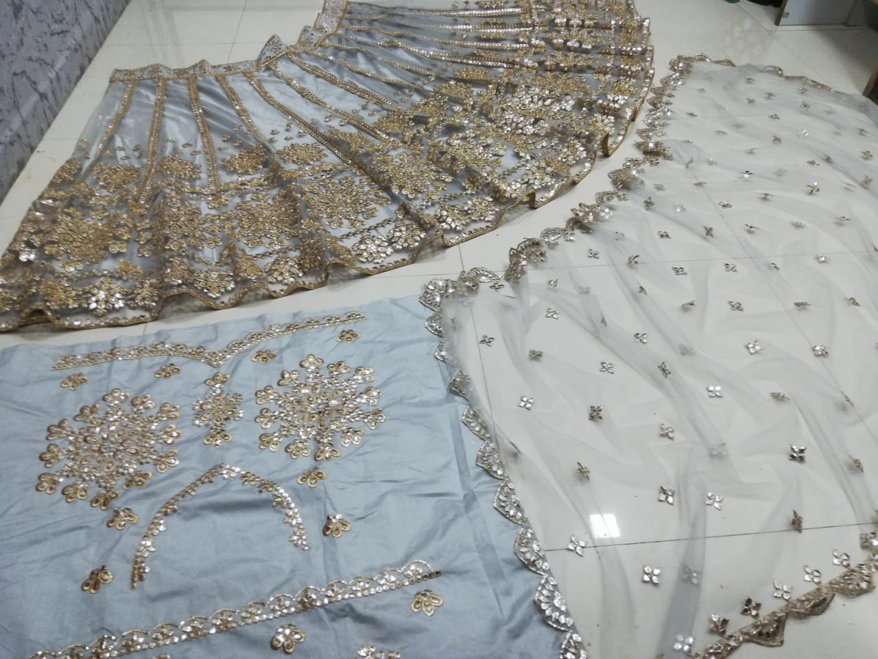 ELEGANT GRAY NET LEHENGA CHOLI SET WITH PAPER MIRROR EMBROIDERY WORK